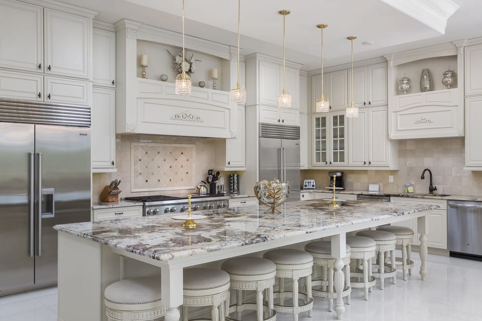 The upgraded kitchen has double appliances, ample granite counter space and breakfast bar seating