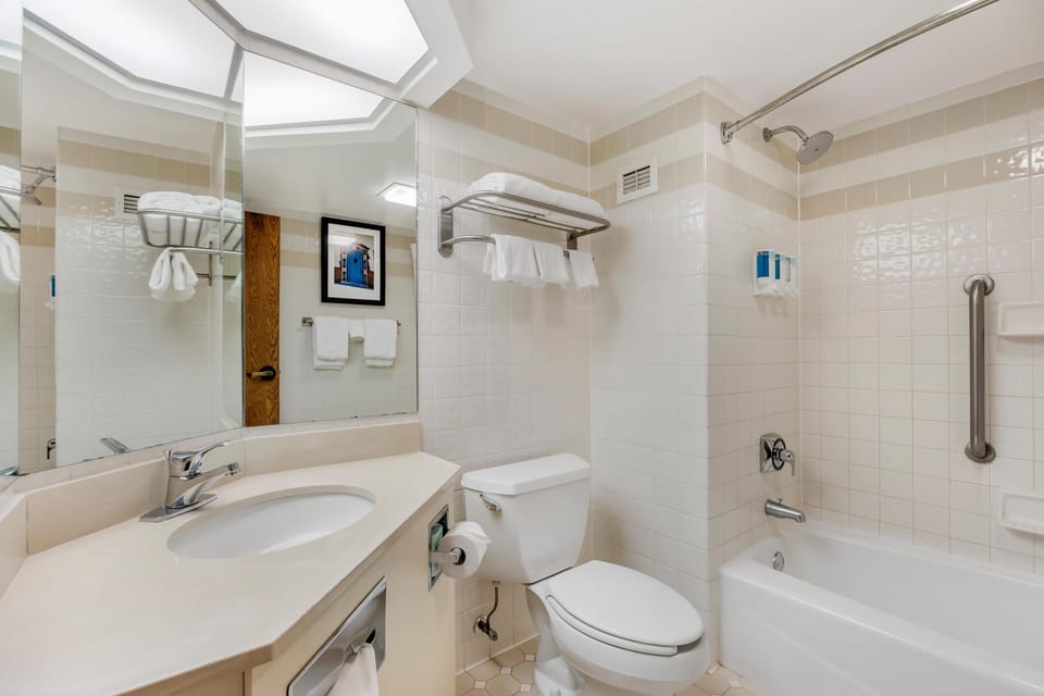 Room, 2 Queen Beds | Bathroom | Combined shower/tub, eco-friendly toiletries, hair dryer, towels