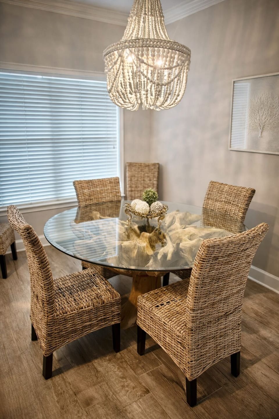 Beautiful glass-top dining table with natural ‘tree stump’ base and six chairs.