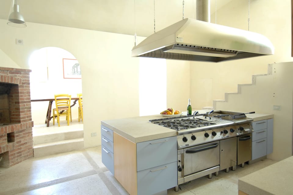 View of the professional kitchen and passage to kitchen nook