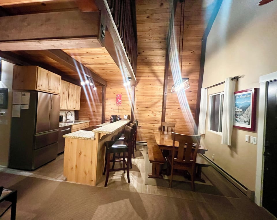 Main level dining area with primary kitchen 