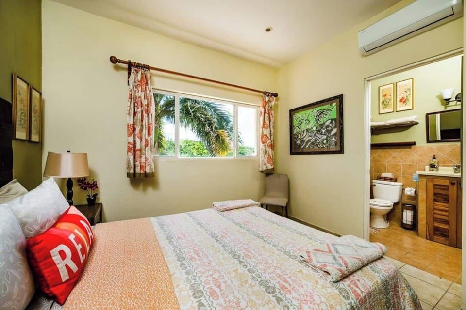 Clean and modern second bathroom at this Tamarindo hideaway. Walk-in shower, fresh towels, and essential toiletries provided. Conveniently located near second bedroom, perfect for guests or family members wanting privacy and comfort during stay.