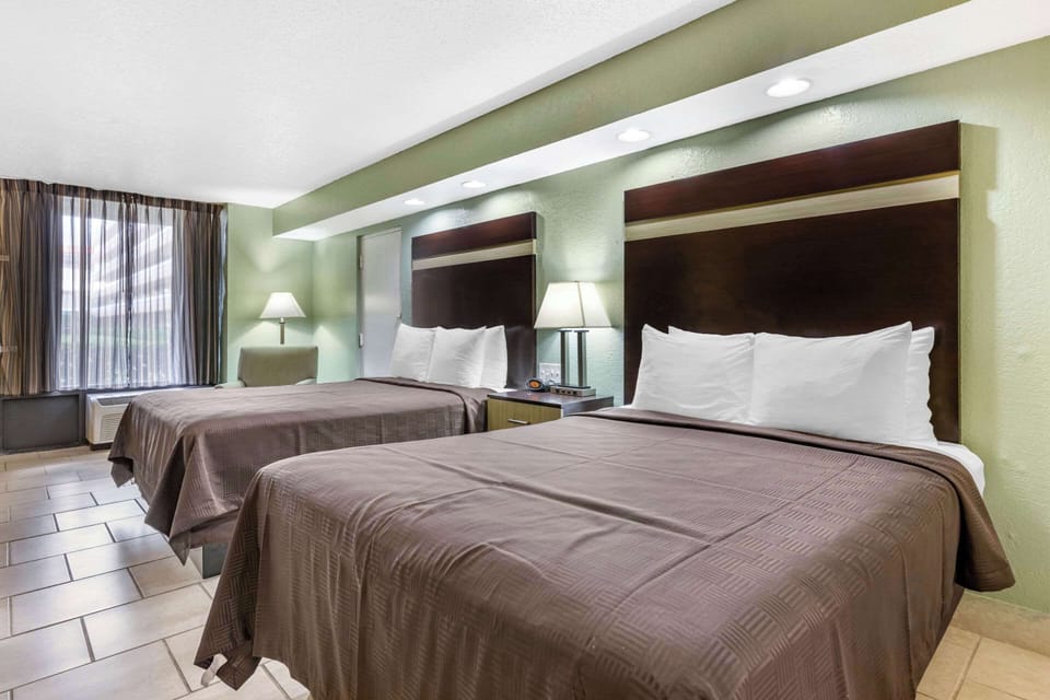 Room, 2 Queen Beds, Non Smoking, Ground Floor | Premium bedding, down comforters, pillowtop beds, individually decorated