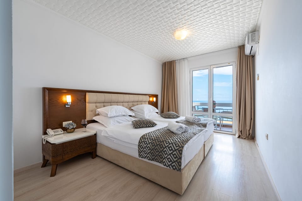 Superior Suite with Sea View | In-room safe, desk, laptop workspace, blackout drapes