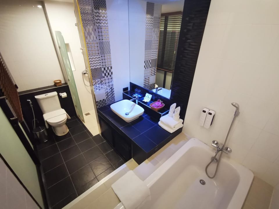 Shower, designer toiletries, hair dryer, slippers