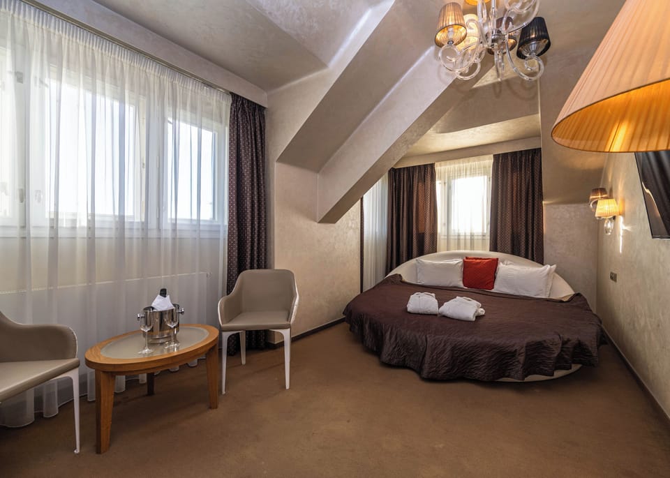 Romantic Suite, 1 King Bed (Round Bed) | Minibar, in-room safe, blackout drapes, soundproofing