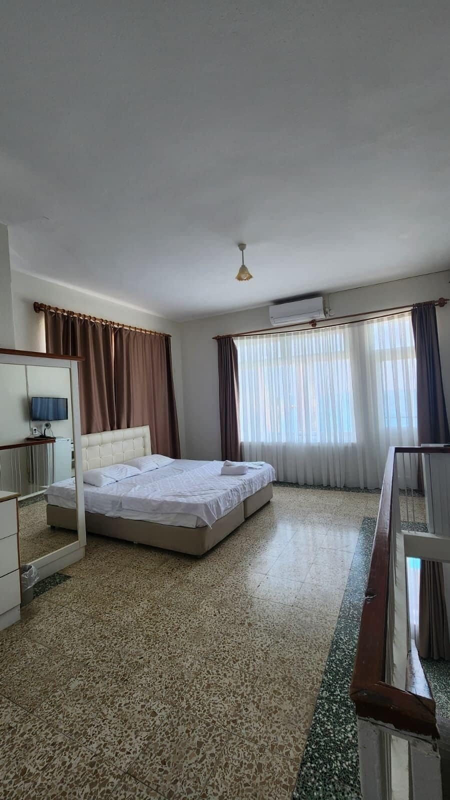 Deluxe Duplex | Living area | 40-inch LCD TV with satellite channels