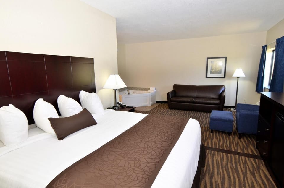 Premium bedding, desk, laptop workspace, blackout drapes