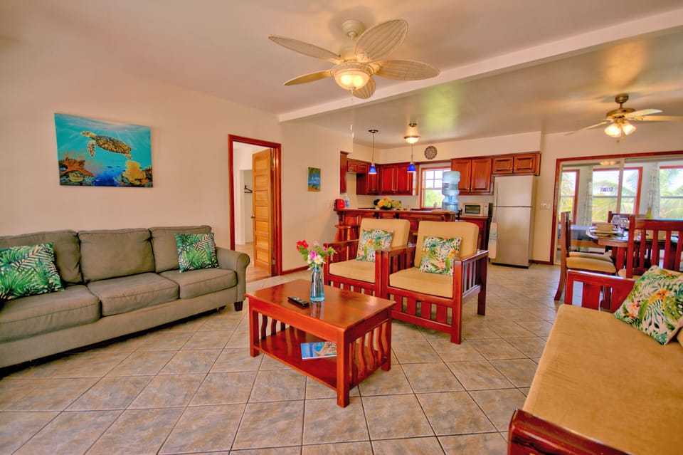 Large spotlessly clean living room featuring solid Mahogany furniture made local