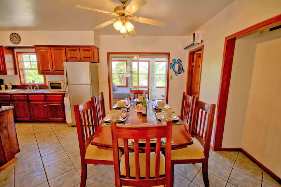 Inviting dining room with brand new place settings for up to 10 persons

