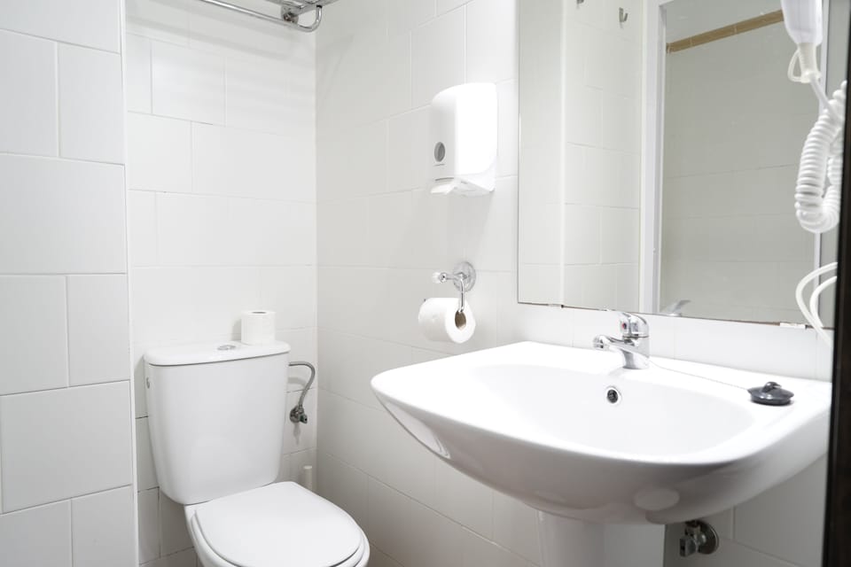 Shower, designer toiletries, hair dryer, towels