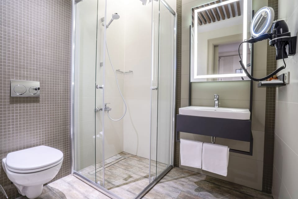 Shower, eco-friendly toiletries, hair dryer, slippers
