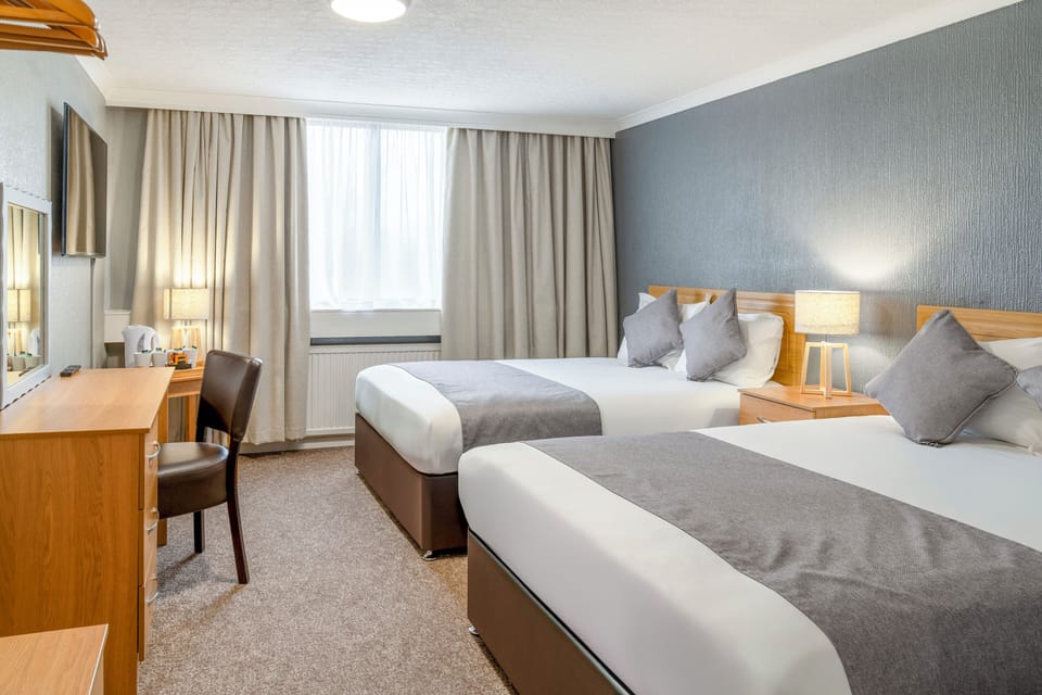 Family Room (2 Adults + 2 Children) | In-room safe, desk, free WiFi, bed sheets