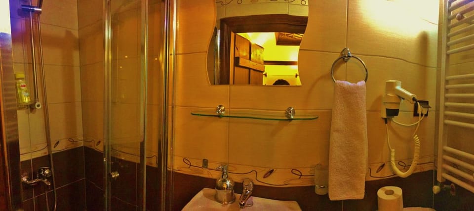 Shower, hair dryer, slippers, towels