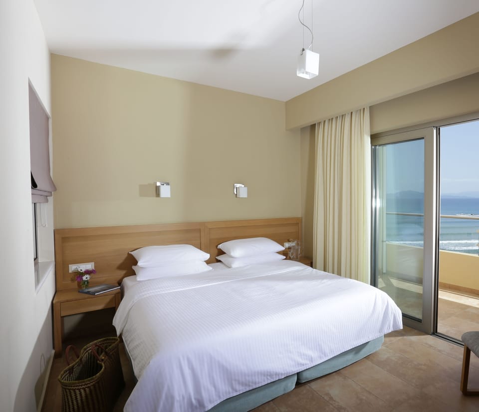 Premium Double Room, Sea View | Minibar, in-room safe, desk, blackout drapes