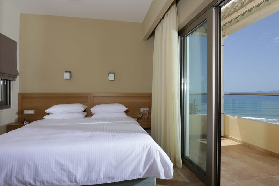 Premium Double Room, Sea View | Minibar, in-room safe, desk, blackout drapes