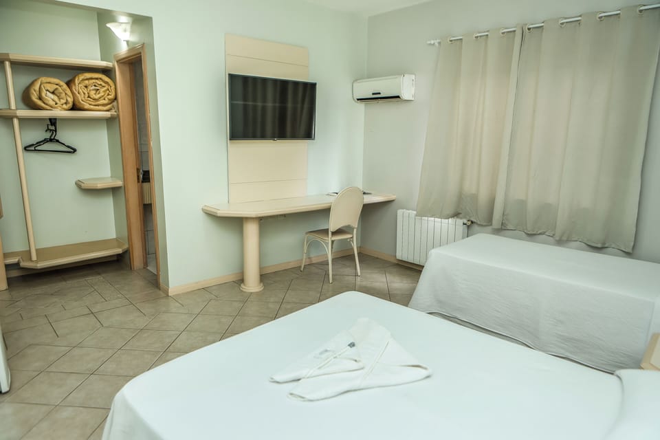Luxury Triple Room, Multiple Beds | Minibar, desk, blackout drapes, free WiFi