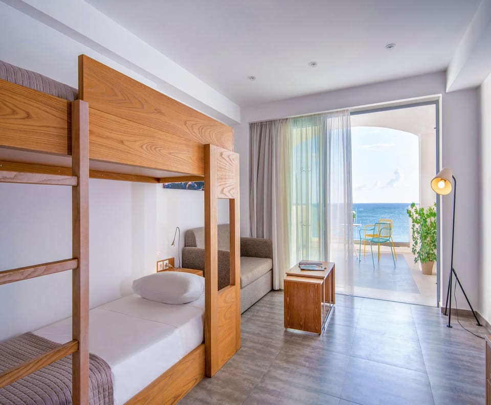 Family Suite, Sea View | 1 bedroom, in-room safe, desk, cribs/infant beds