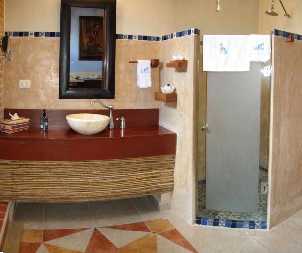 Junior Suite, 1 Queen Bed | Bathroom | Shower, free toiletries, hair dryer, bathrobes
