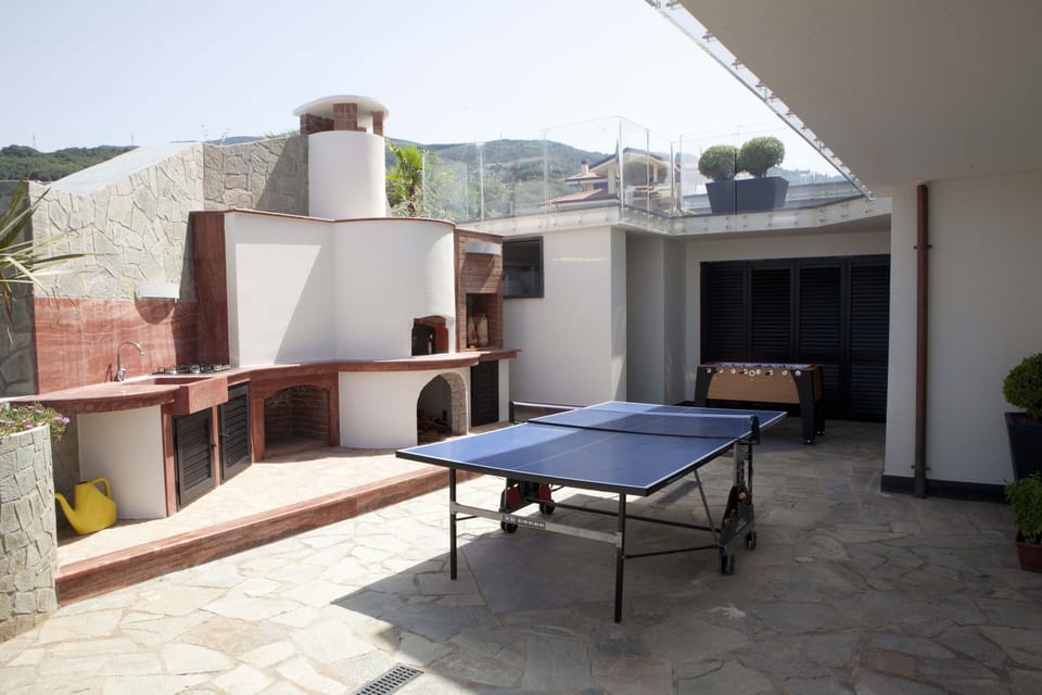 Games area and pizza oven/BBQ corner