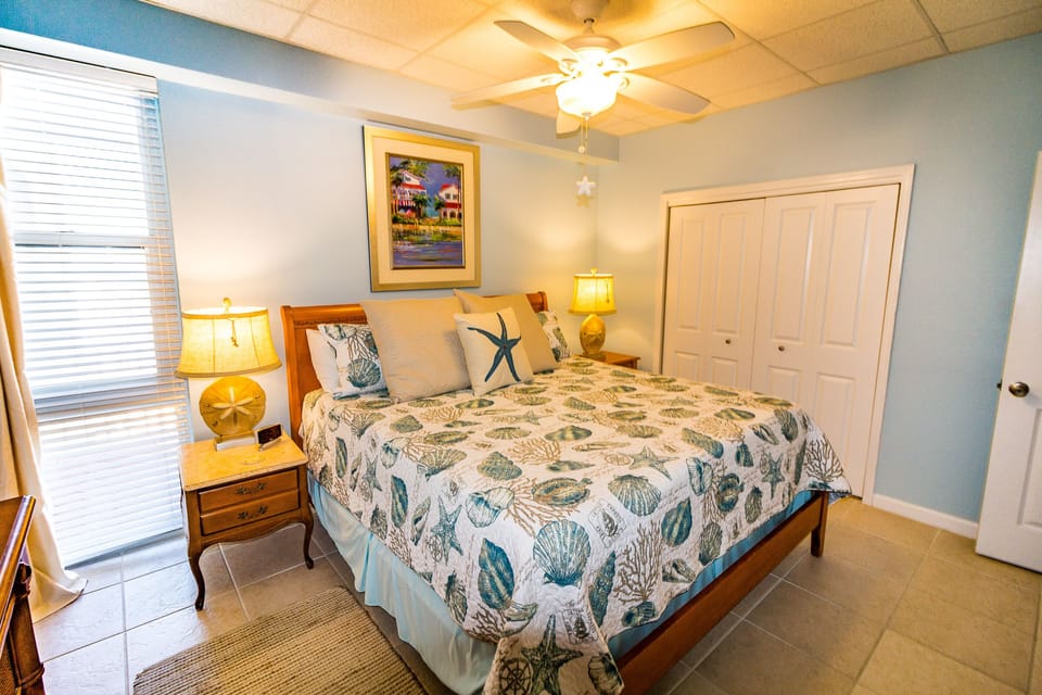 King size bed with private bath and 42" flat screen Smart TV mounted on the wall