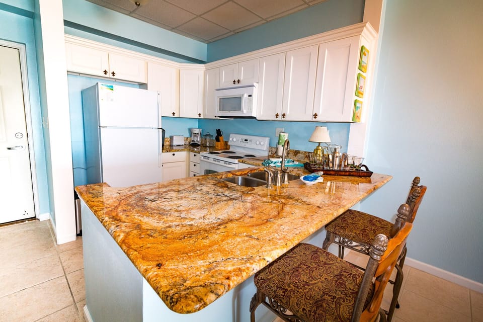 Granite counter tops with seating for 2 at the bar
