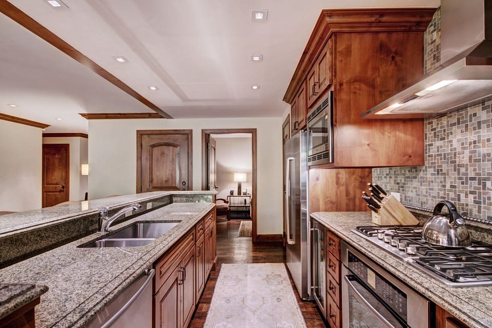 Condo, 2 Bedrooms | Private kitchen | Full-size fridge, microwave, oven, stovetop