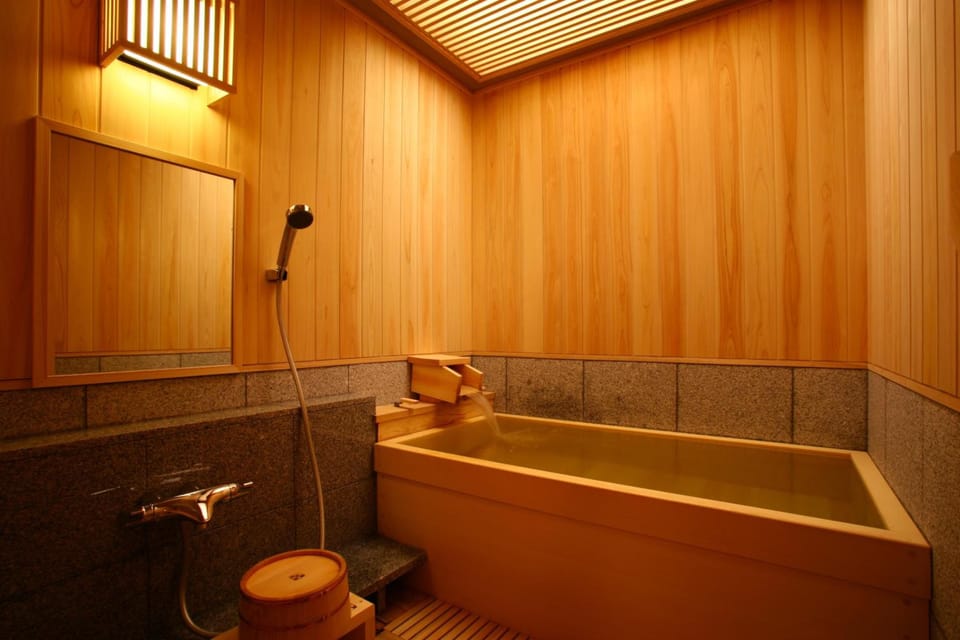 Separate tub and shower, free toiletries, hair dryer, slippers