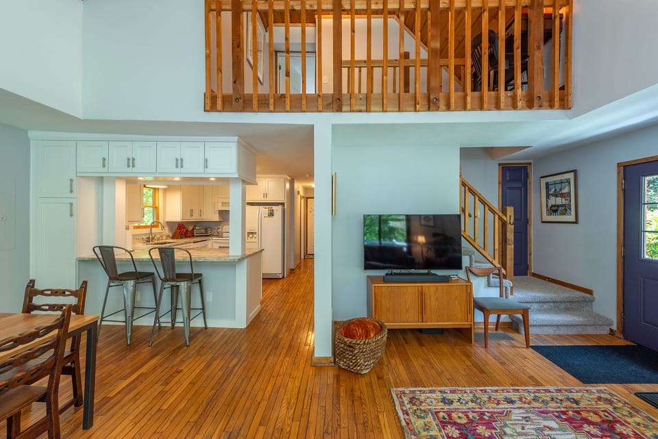 Small upstairs loft has a work station with desk.