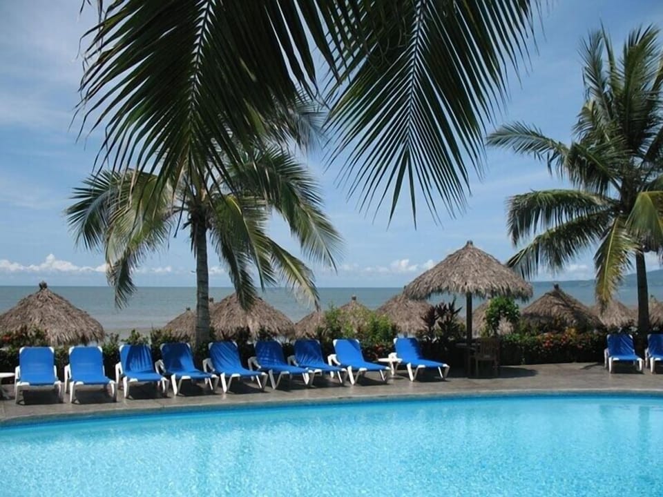 Adult pool and pacific ocean back drop
