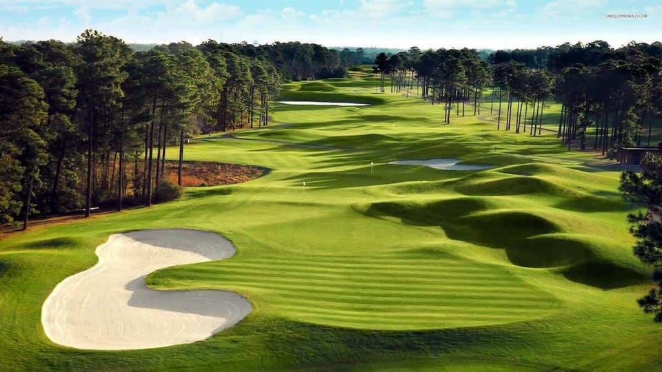 Discover the stunning golf course just steps away from your condo, offering an idyllic setting for a leisurely evening stroll.