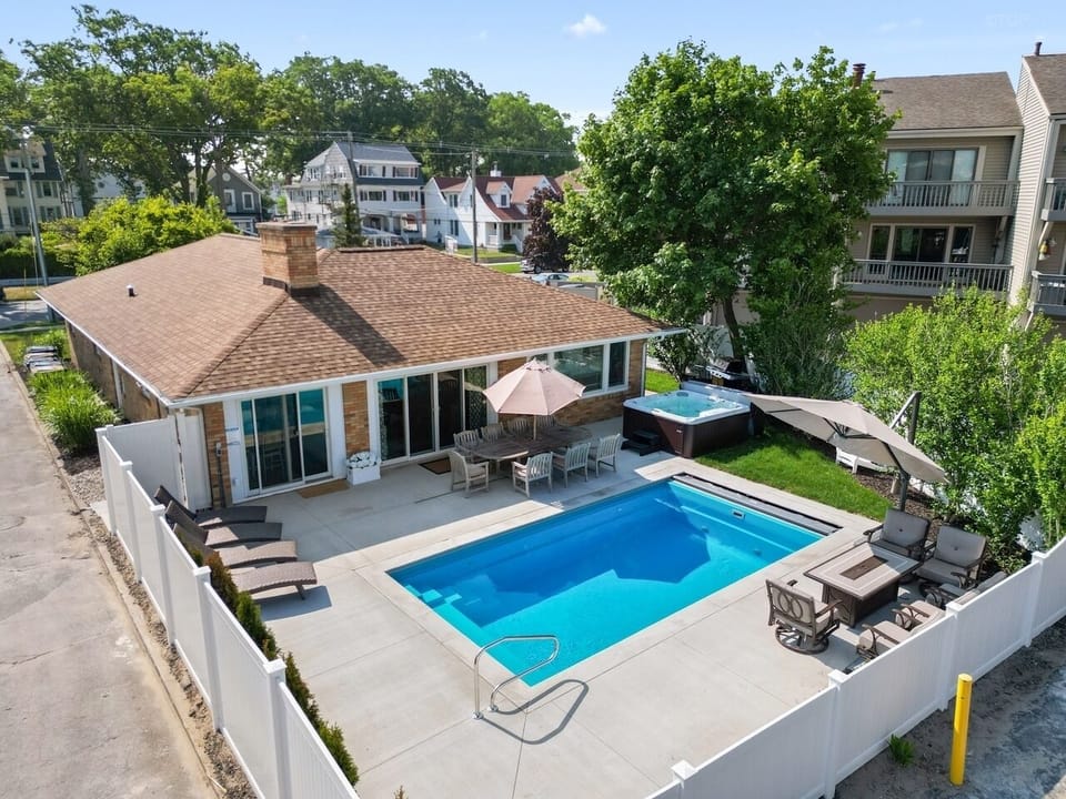 Brand new pool, hot tub, fire pit and backyard area right next to the beach!  