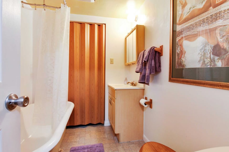 Bathroom with club foot tub.