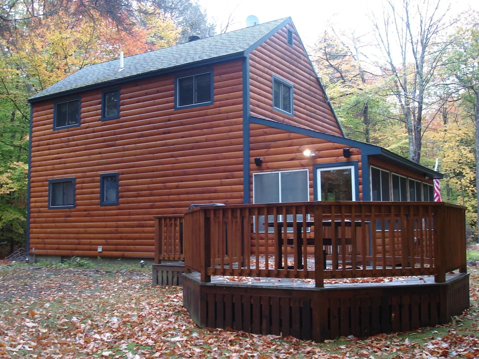rear of the house with deck and grill