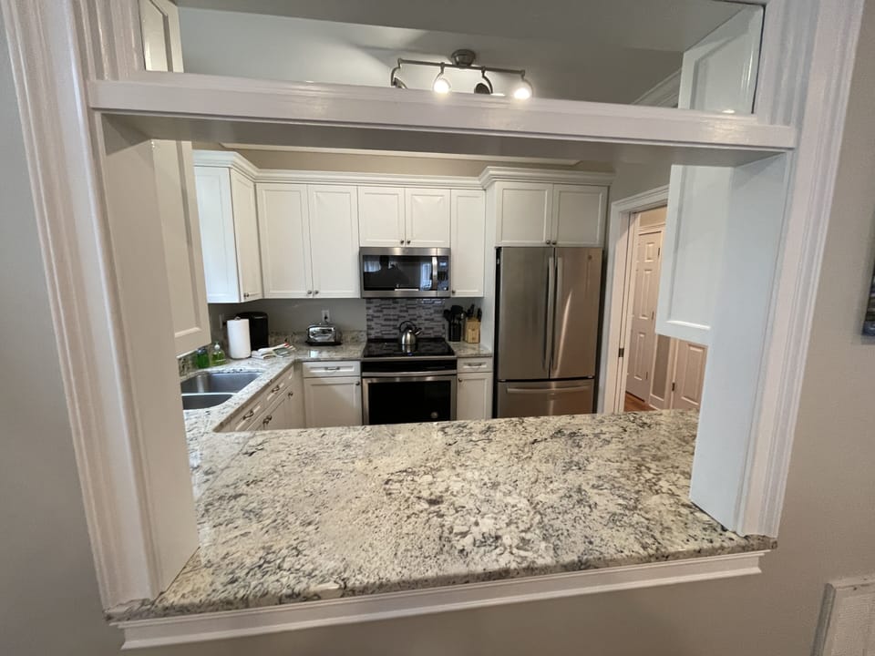 opening to kitchen from dining area
