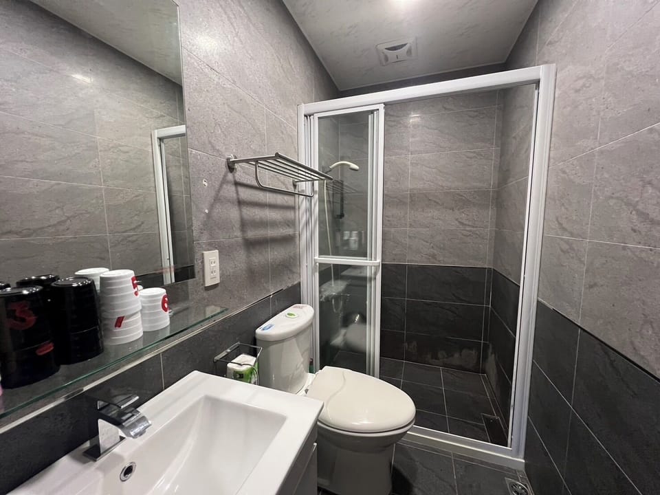 Family Apartment, Multiple Beds | Bathroom | Hair dryer, slippers