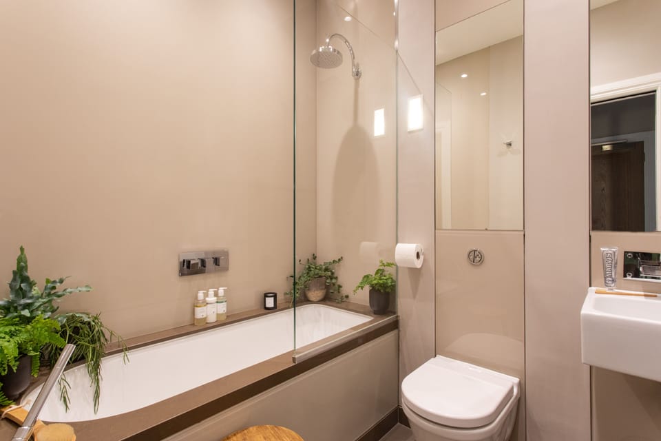 Premium Apartment, 1 King Bed | Bathroom | Combined shower/tub, free toiletries, hair dryer, bathrobes