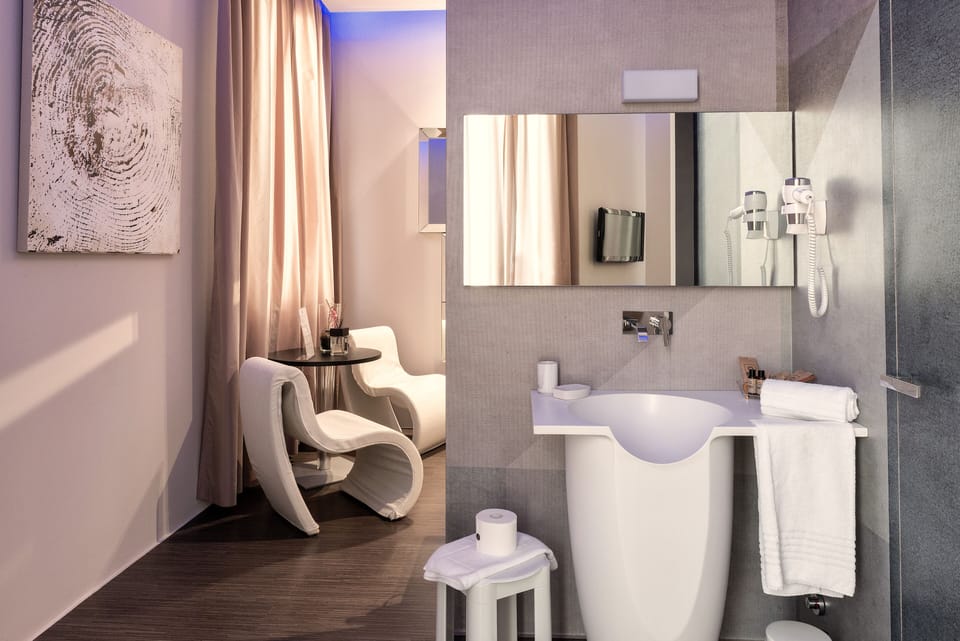 Luxury Suite, 1 Bedroom, Balcony | Living area | Flat-screen TV, first-run movies