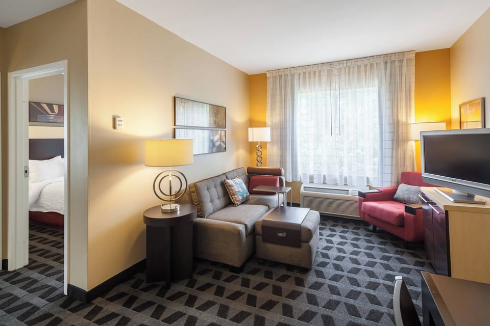 Suite, 2 Bedrooms | Living area | 32-inch flat-screen TV with satellite channels, TV