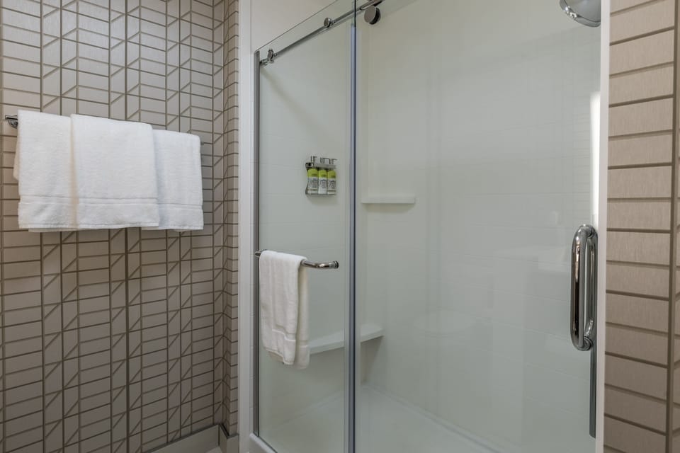 Rainfall showerhead, eco-friendly toiletries, hair dryer, towels