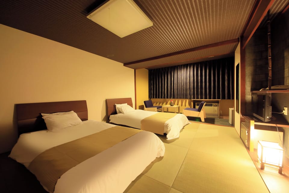 Japanese-style Twin Room, Non Smoking (2 beds) | Down comforters, in-room safe, desk, WiFi (free)