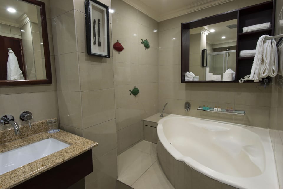 Separate tub and shower, deep soaking tub, free toiletries, hair dryer