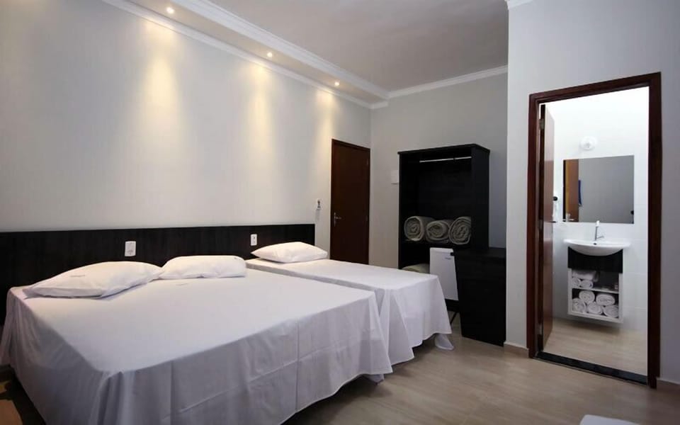 Triple Room | Minibar, desk, blackout drapes, iron/ironing board
