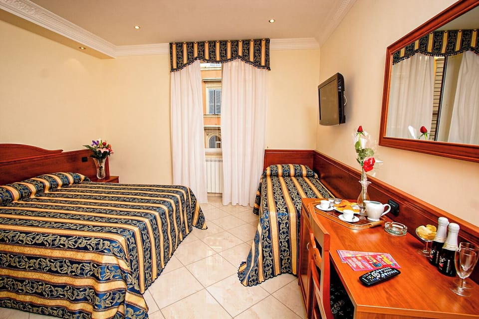 Quadruple Room | Premium bedding, minibar, in-room safe, individually decorated