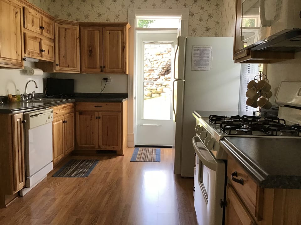 New hickory kitchen with access to deck with beautiful waterfalls and view