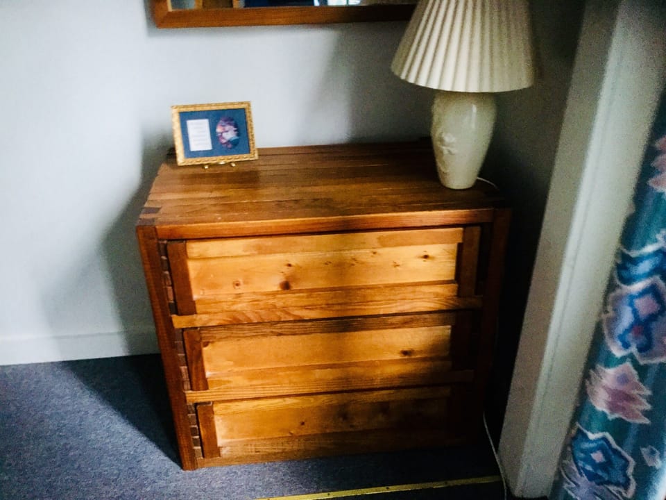 Dresser located in the bedroom with double bunk beds