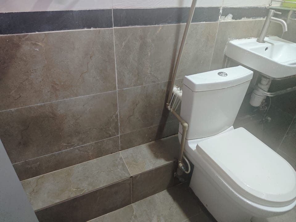 Hair dryer, slippers, shampoo, toilet paper
