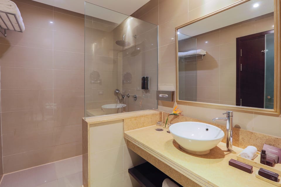 Designer toiletries, hair dryer, bathrobes, slippers
