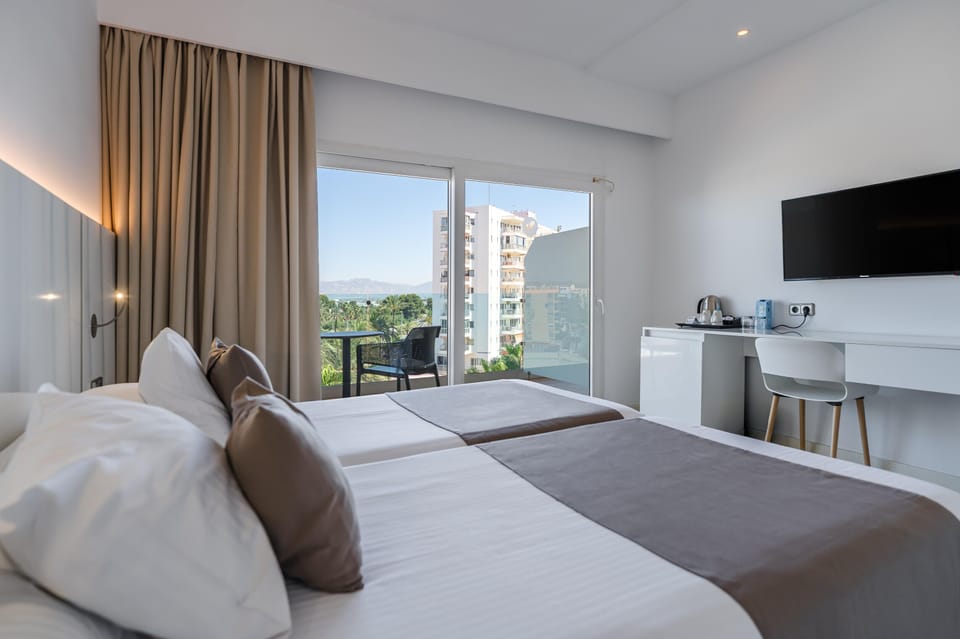 Superior Double Room, Balcony, Partial Sea View | Desk, WiFi (free), bed sheets