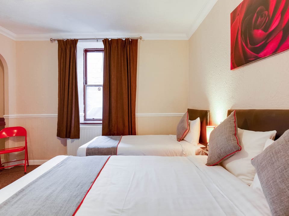 Triple Room, Multiple Beds | Desk, iron/ironing board, free cribs/infant beds, free WiFi